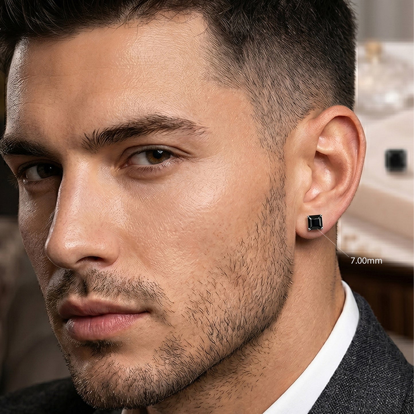 Close-up of a man wearing a black earring 