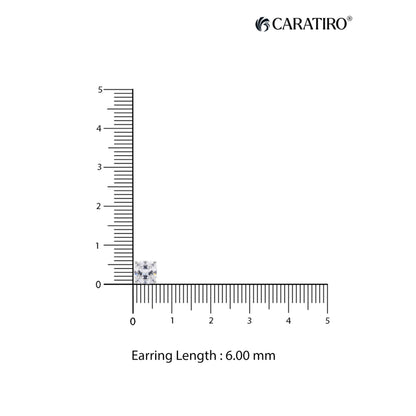 Measurement of an earring length with a ruler and Caratiro branding
