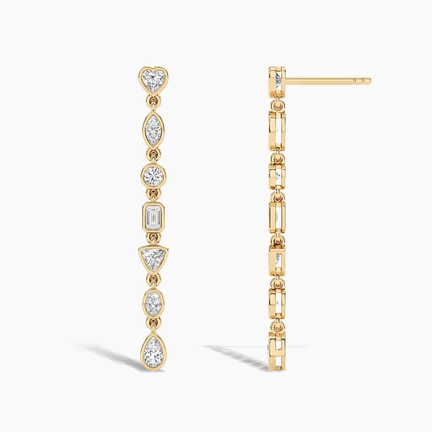 Gold earrings with diamond accents on a white background