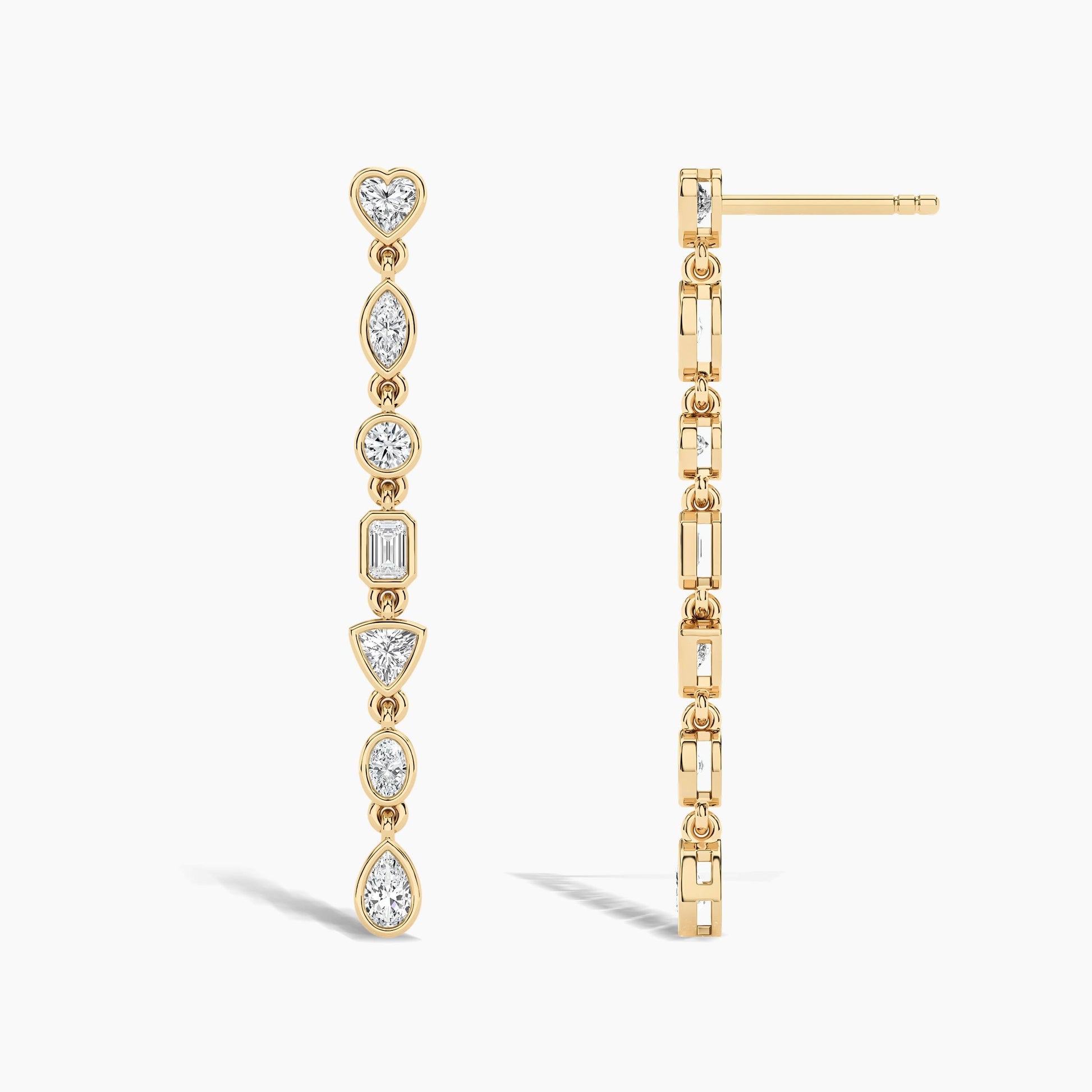 Gold earrings with diamond accents on a white background