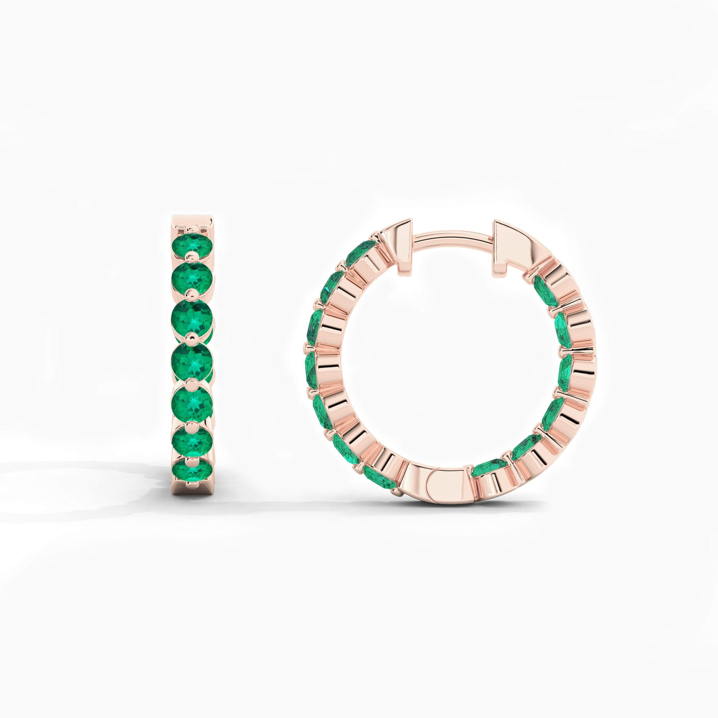 Rose gold hoop earrings with green gemstones on a white background
