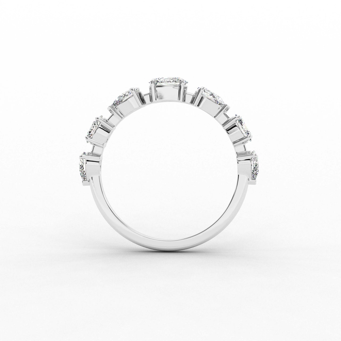 Silver ring with multiple gemstones on a white background