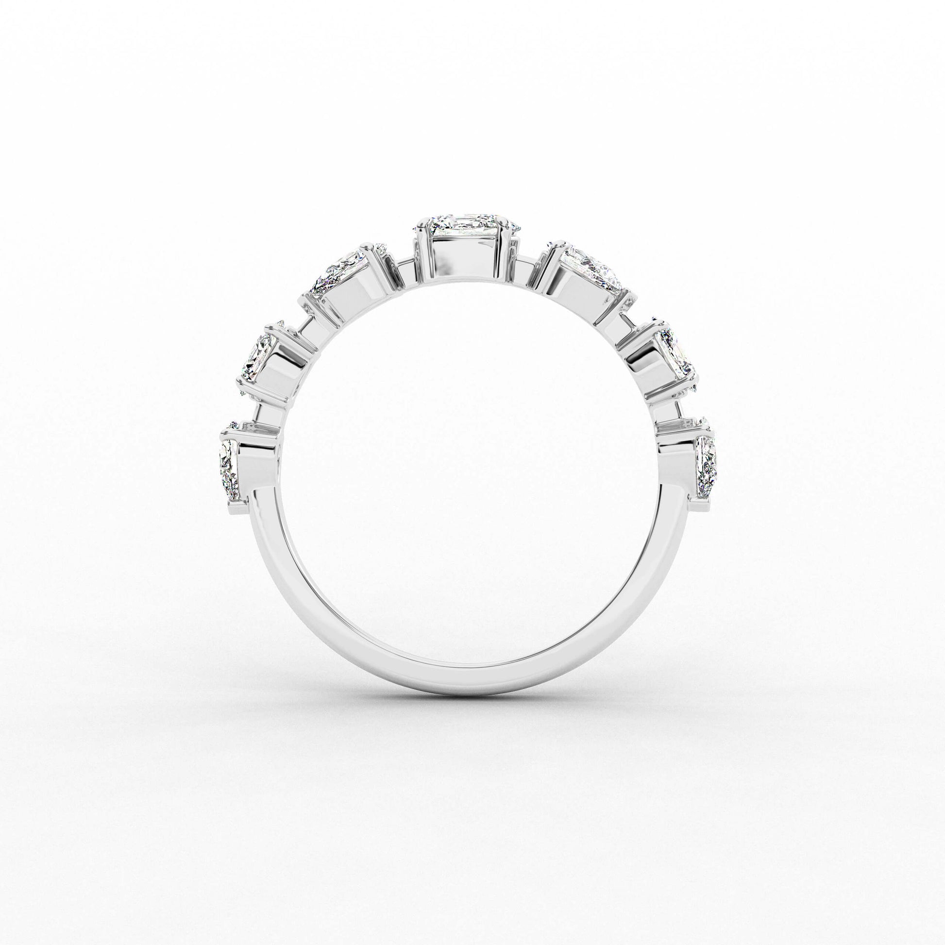 Silver ring with multiple gemstones on a white background