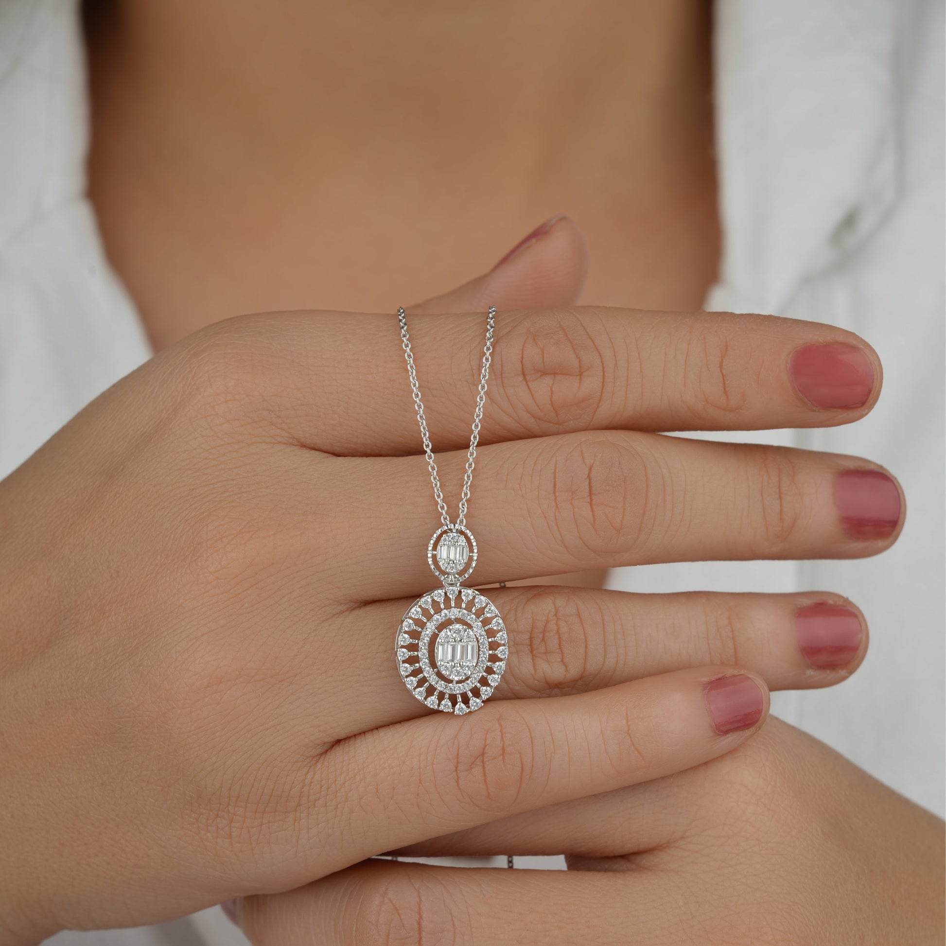 Silver necklace with a circular pendant 