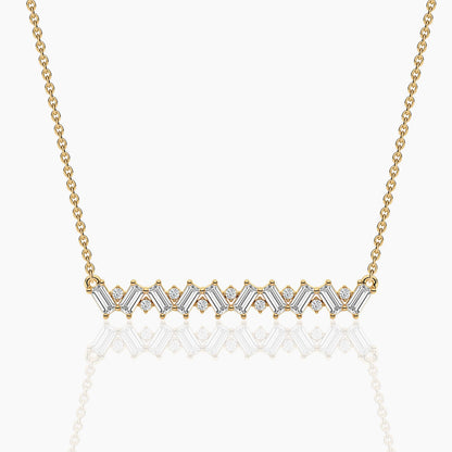 Gold necklace with diamond accents on a white background