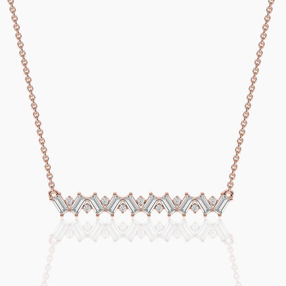 Rose gold necklace with a diamond pendant on a white background
