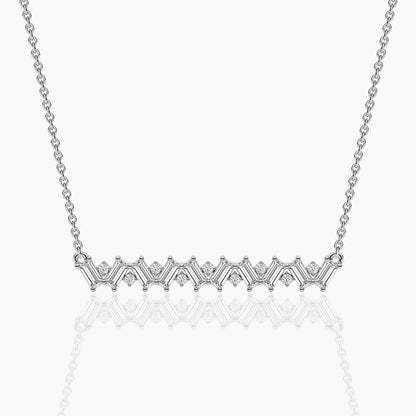 Silver necklace with a delicate chain on a white background