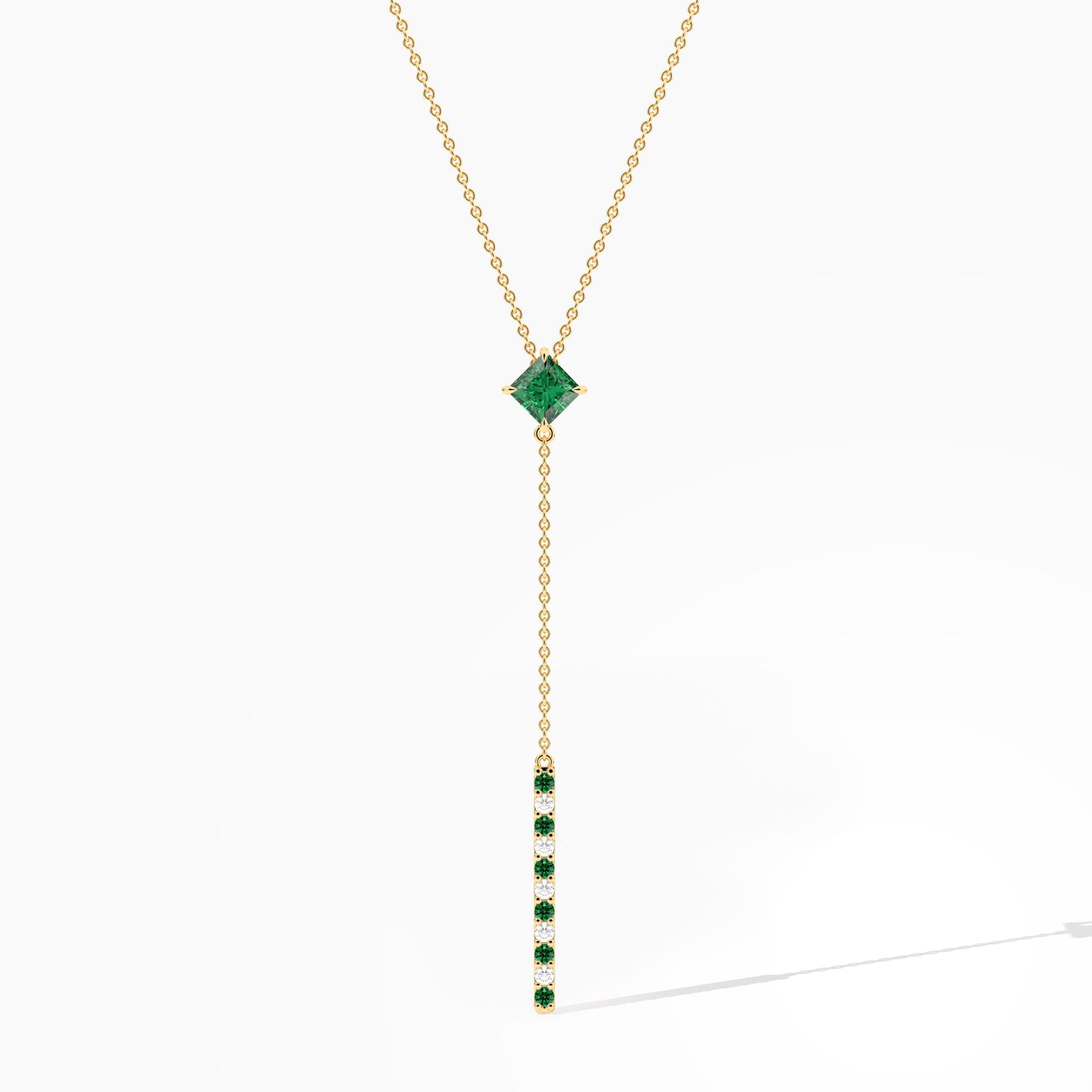 Gold necklace with a green gemstone pendant