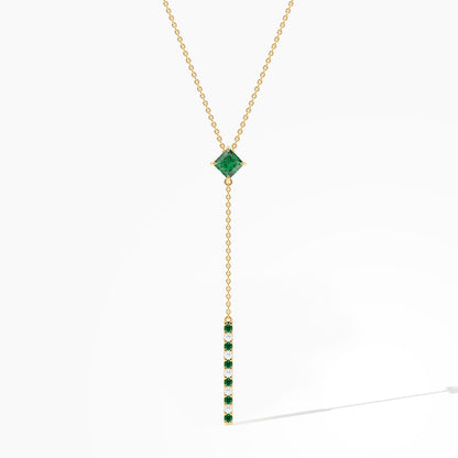 Gold necklace with a green gemstone pendant