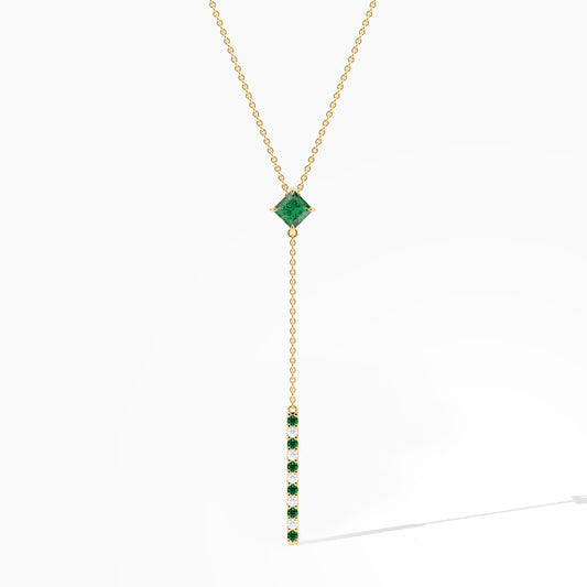 Gold necklace with a green gemstone pendant