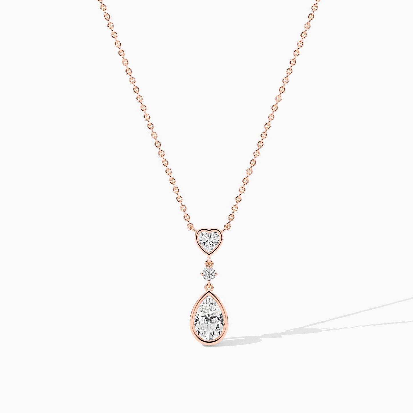 Rose gold necklace with heart and teardrop-shaped pendant 