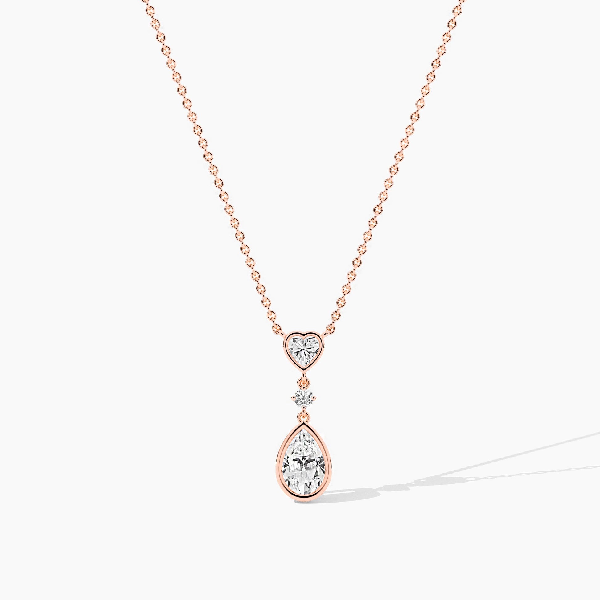 Rose gold necklace with heart and teardrop-shaped pendant 