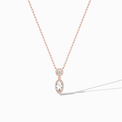 Rose gold necklace with a teardrop-shaped pendant on a white background