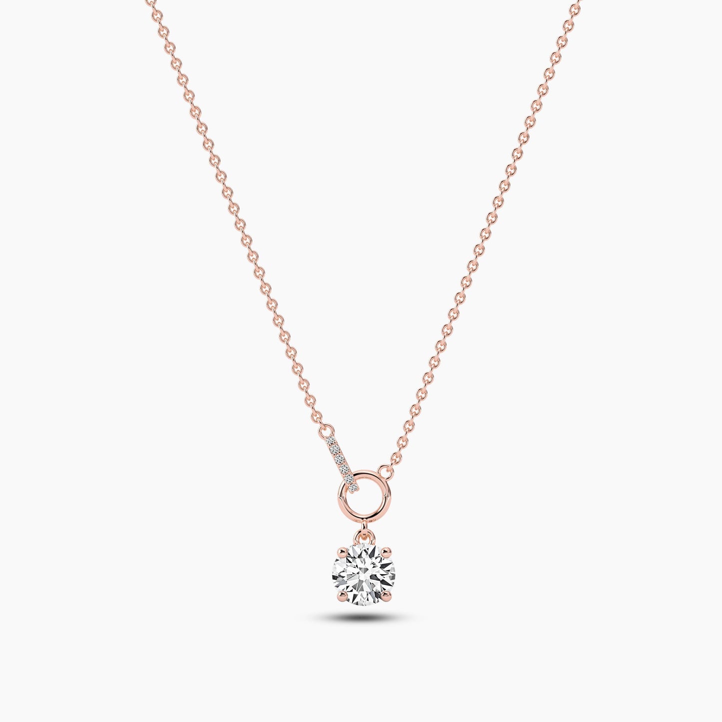 Rose gold necklace with a diamond pendant on a white background