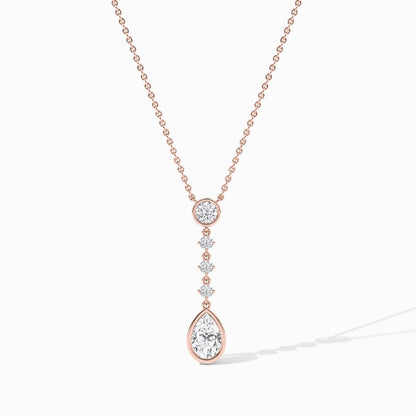 Rose gold necklace with a teardrop pendant on a white background