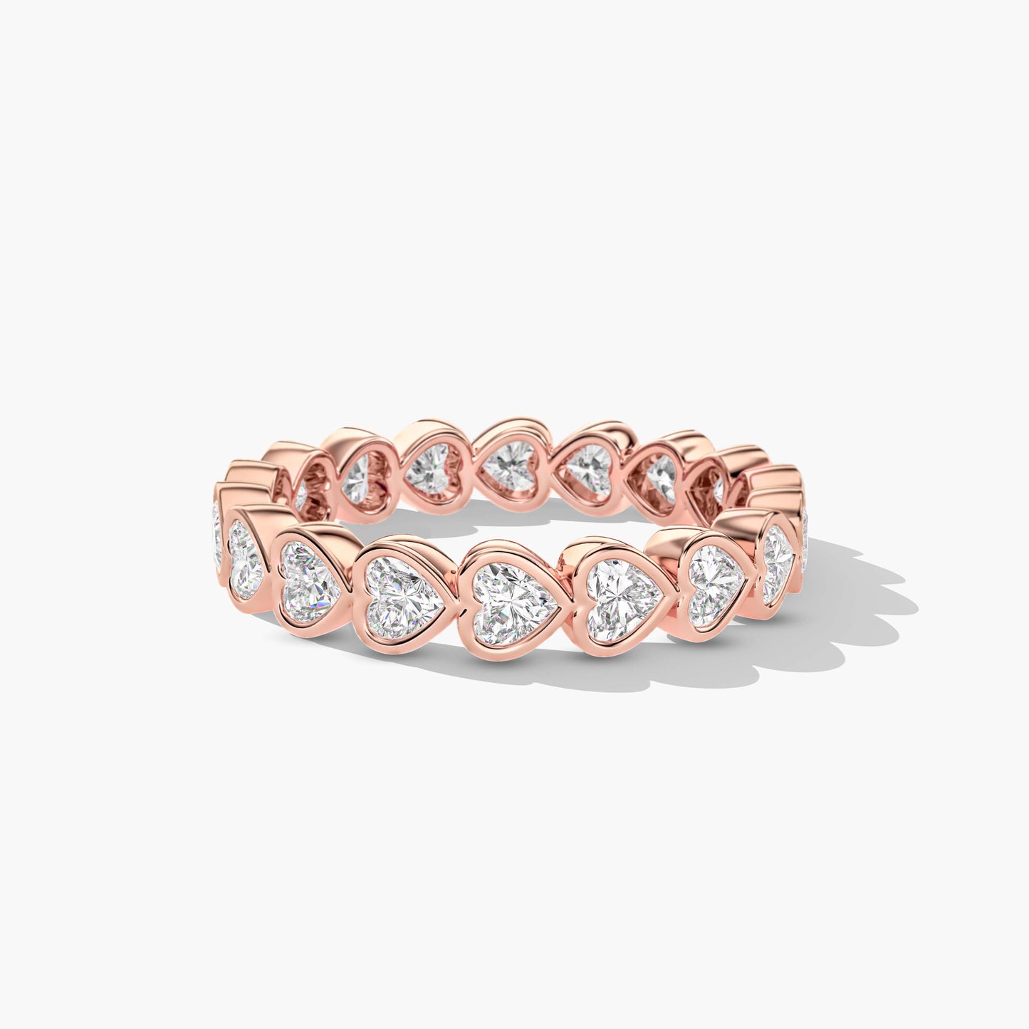 Rose gold ring with heart-shaped gemstones