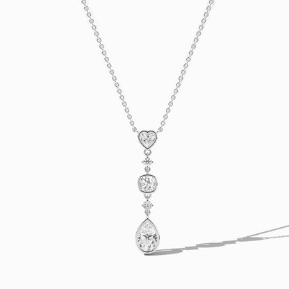 Diamond necklace with heart and teardrop pendants on a white background