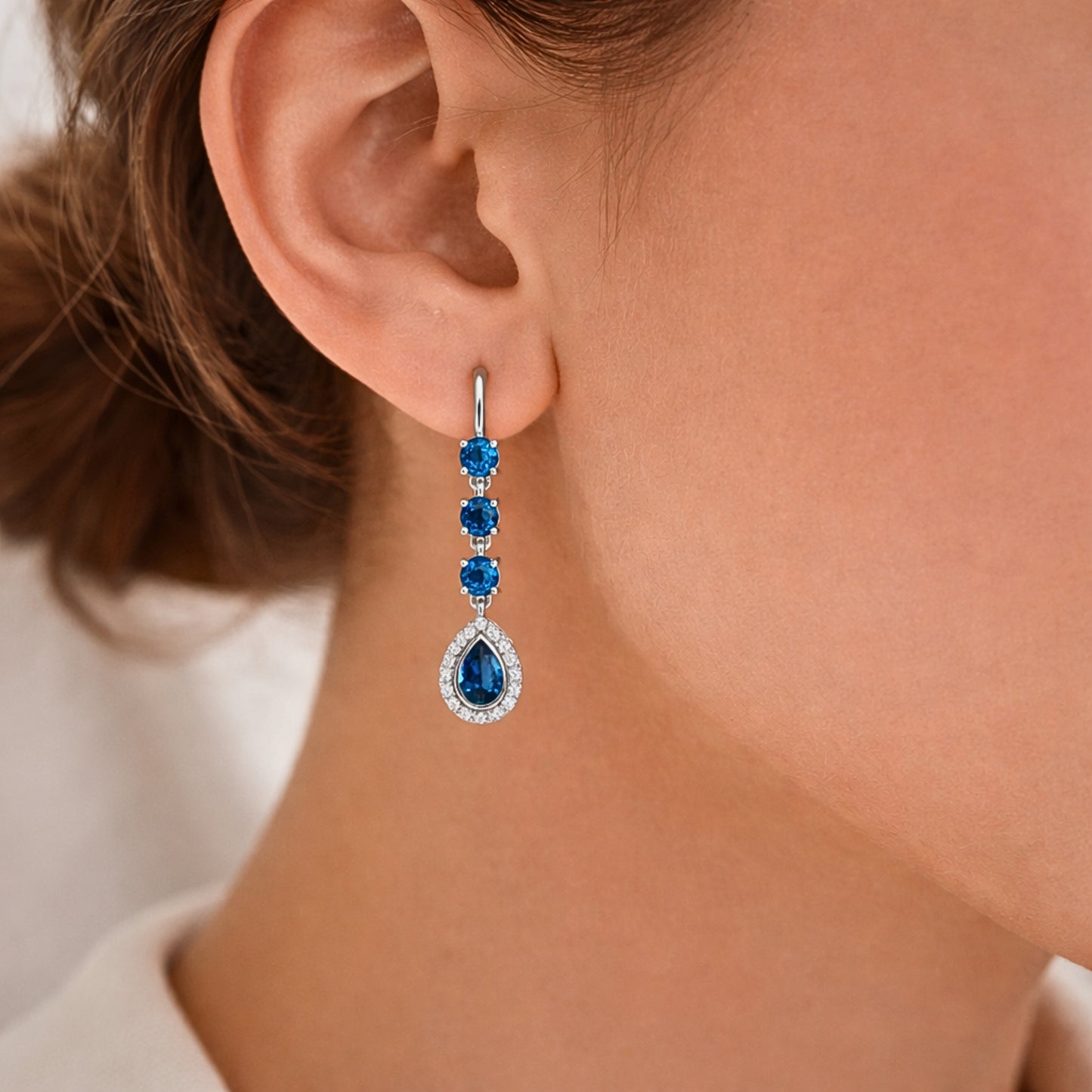 Blue-colored diamond earring