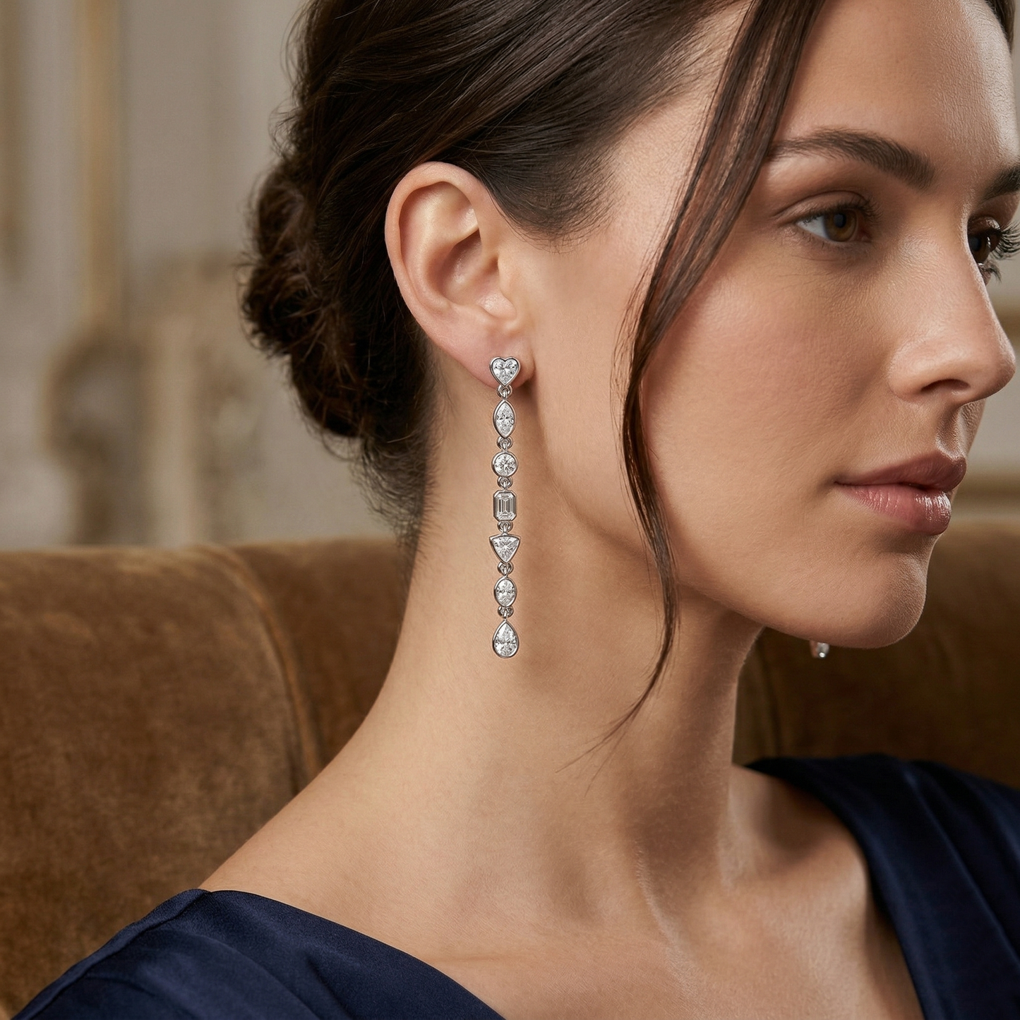 Close-up of a woman wearing elegant earrings with a blurred background