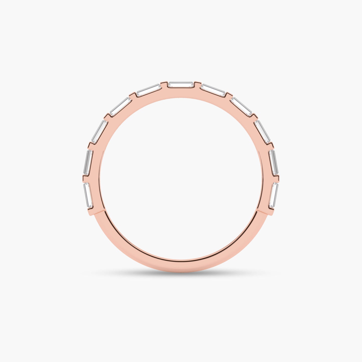 Rose gold ring with a white stone on a light beige background