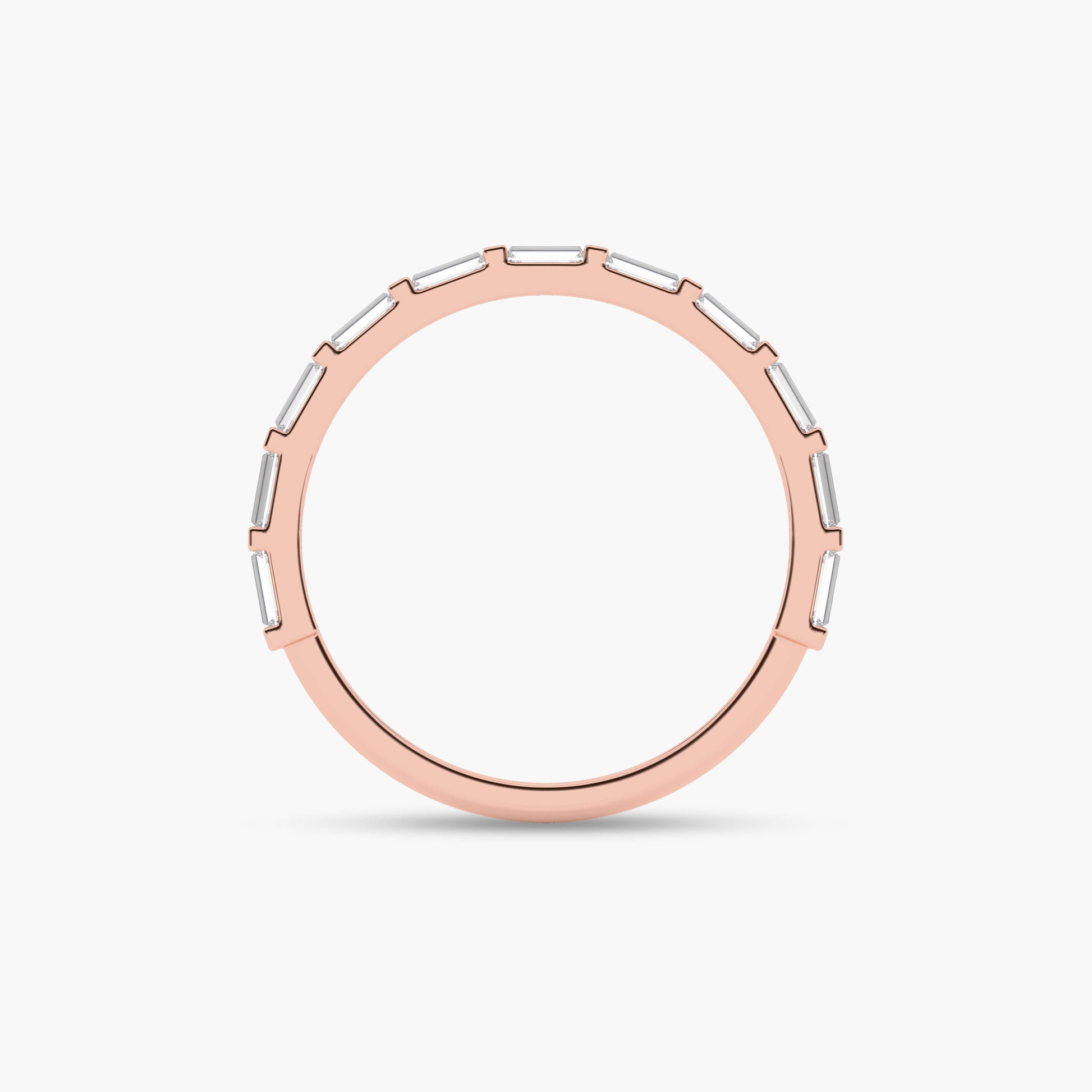 Rose gold ring with a white stone on a light beige background