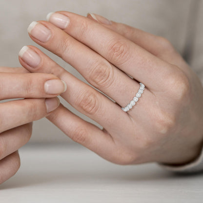 Close-up of a hand wearing a diamond ring 