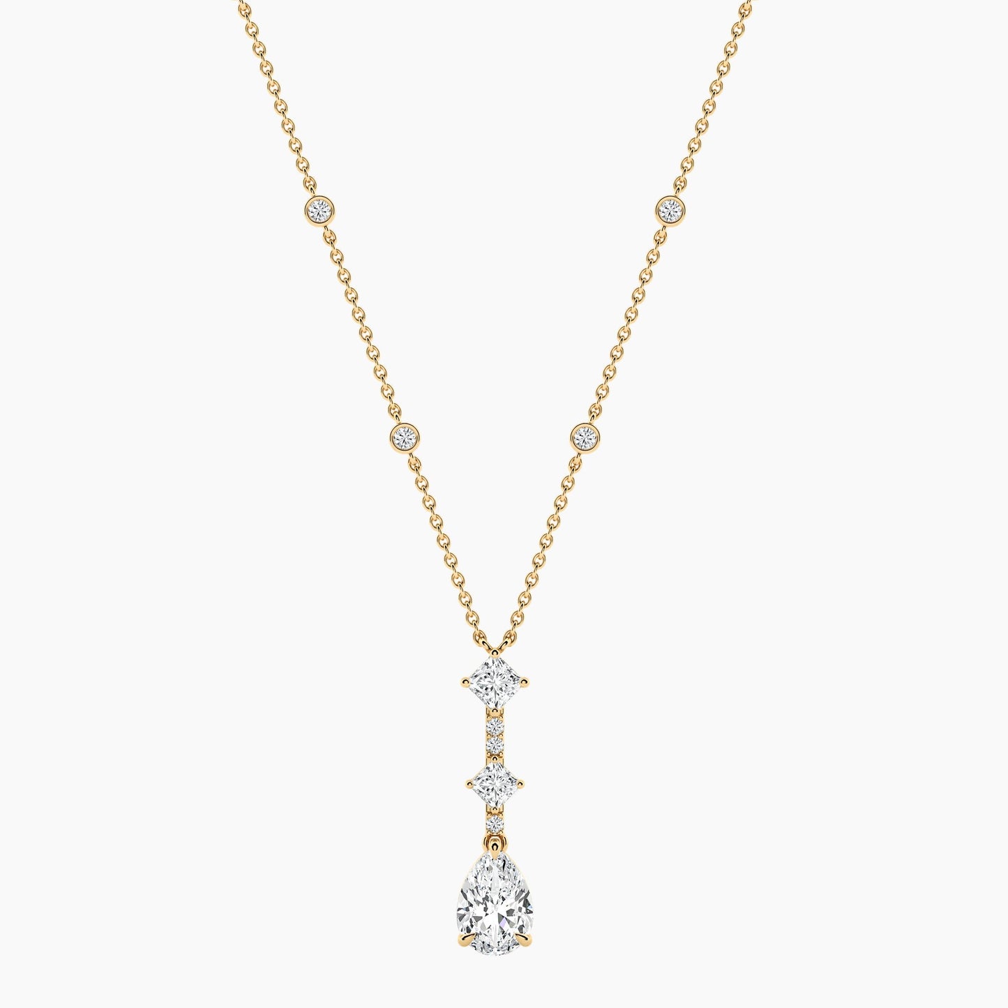 Gold necklace with a diamond pendant on a white background