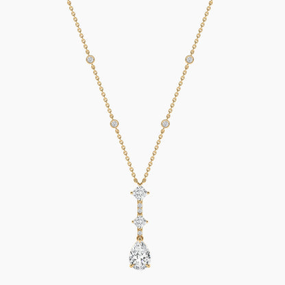 Gold necklace with a diamond pendant on a white background