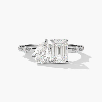 Diamond ring with two prominent gemstones