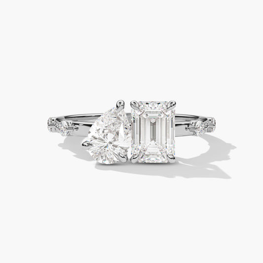 Diamond ring with two prominent gemstones