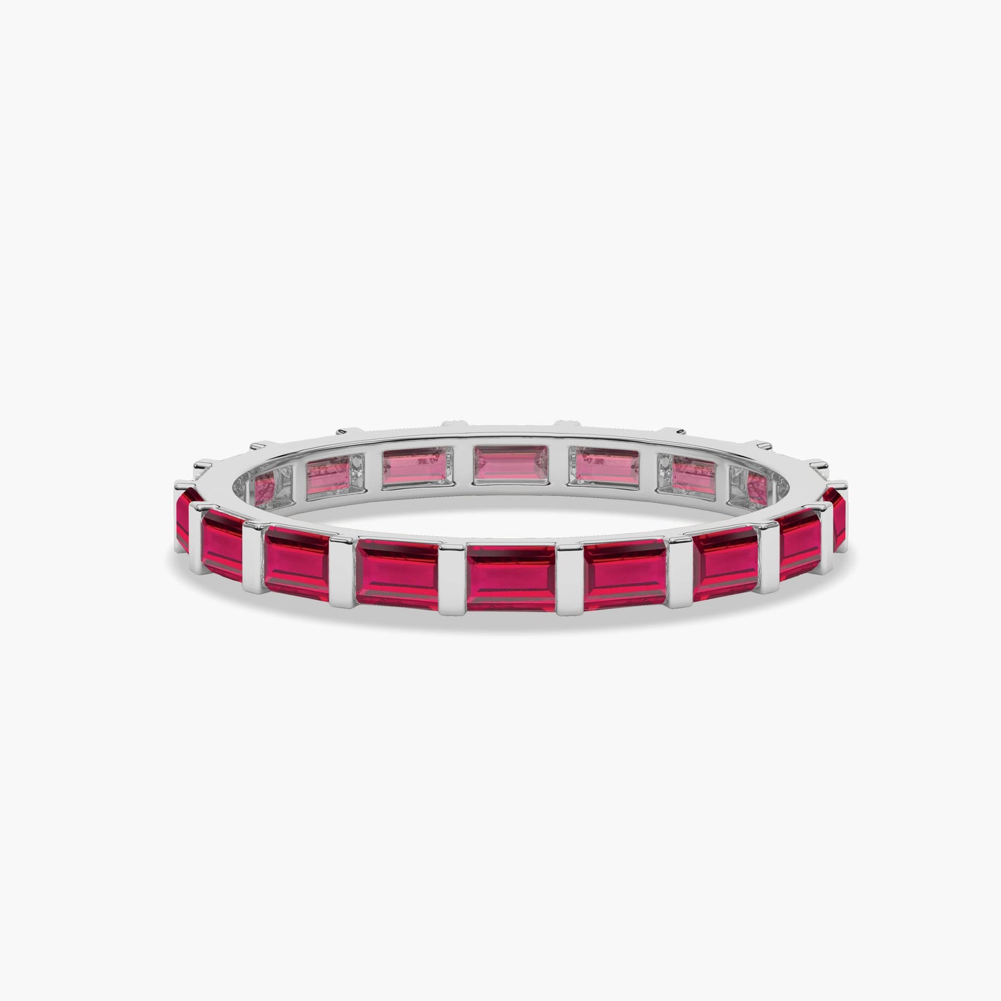 Silver ring with pink gemstones on a white background