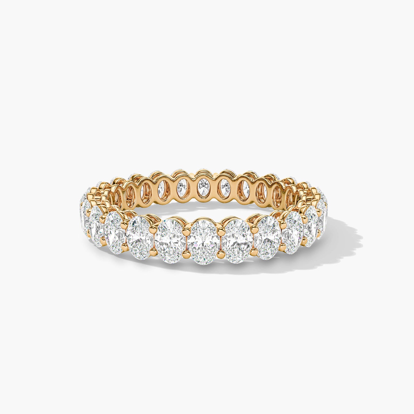 Gold and diamond ring on a white background
