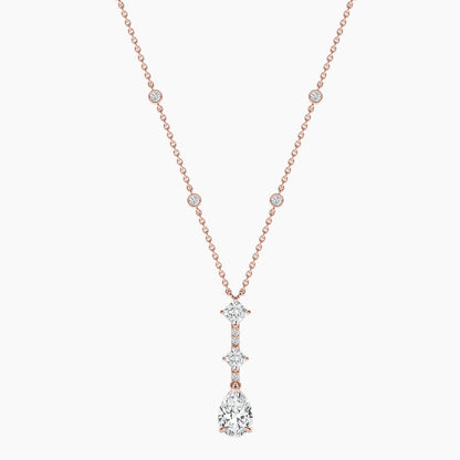 Rose gold necklace with a diamond pendant on a white background