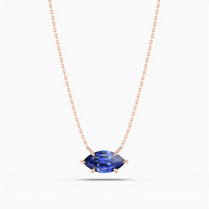 blue-colored diamond necklace in silver