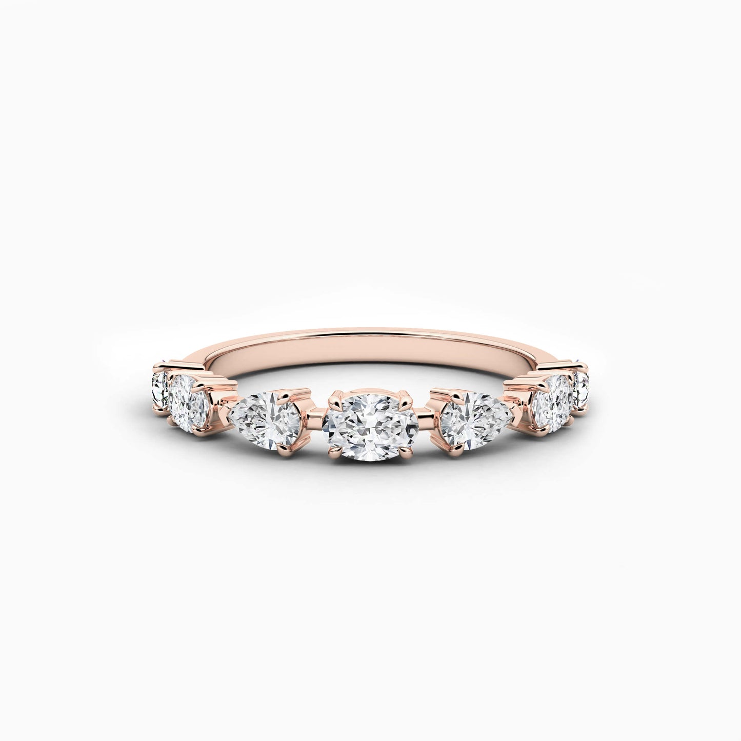 Rose gold ring with diamonds on a white background