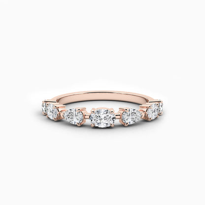 Rose gold ring with diamonds on a white background