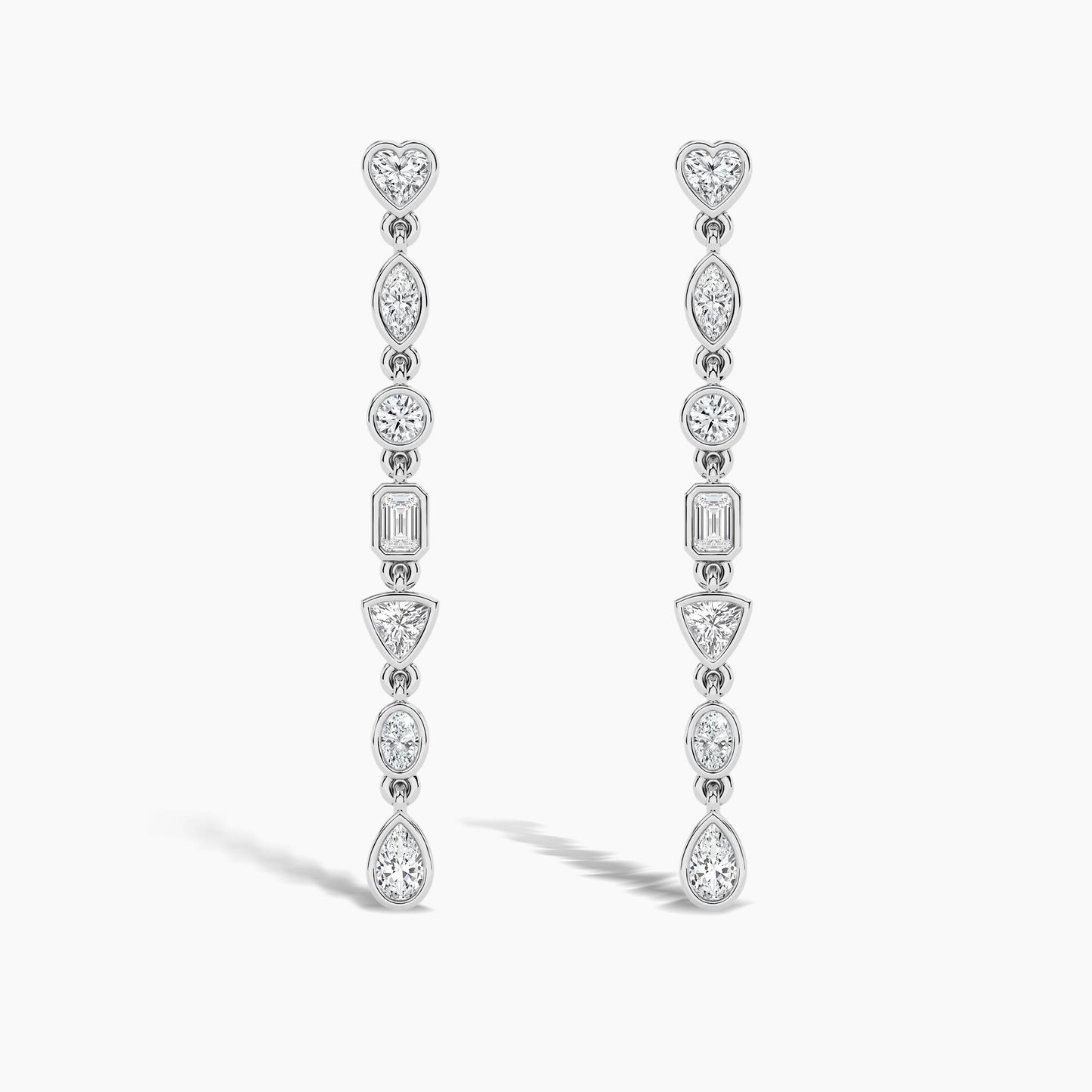 Pair of diamond earrings on a light gray background
