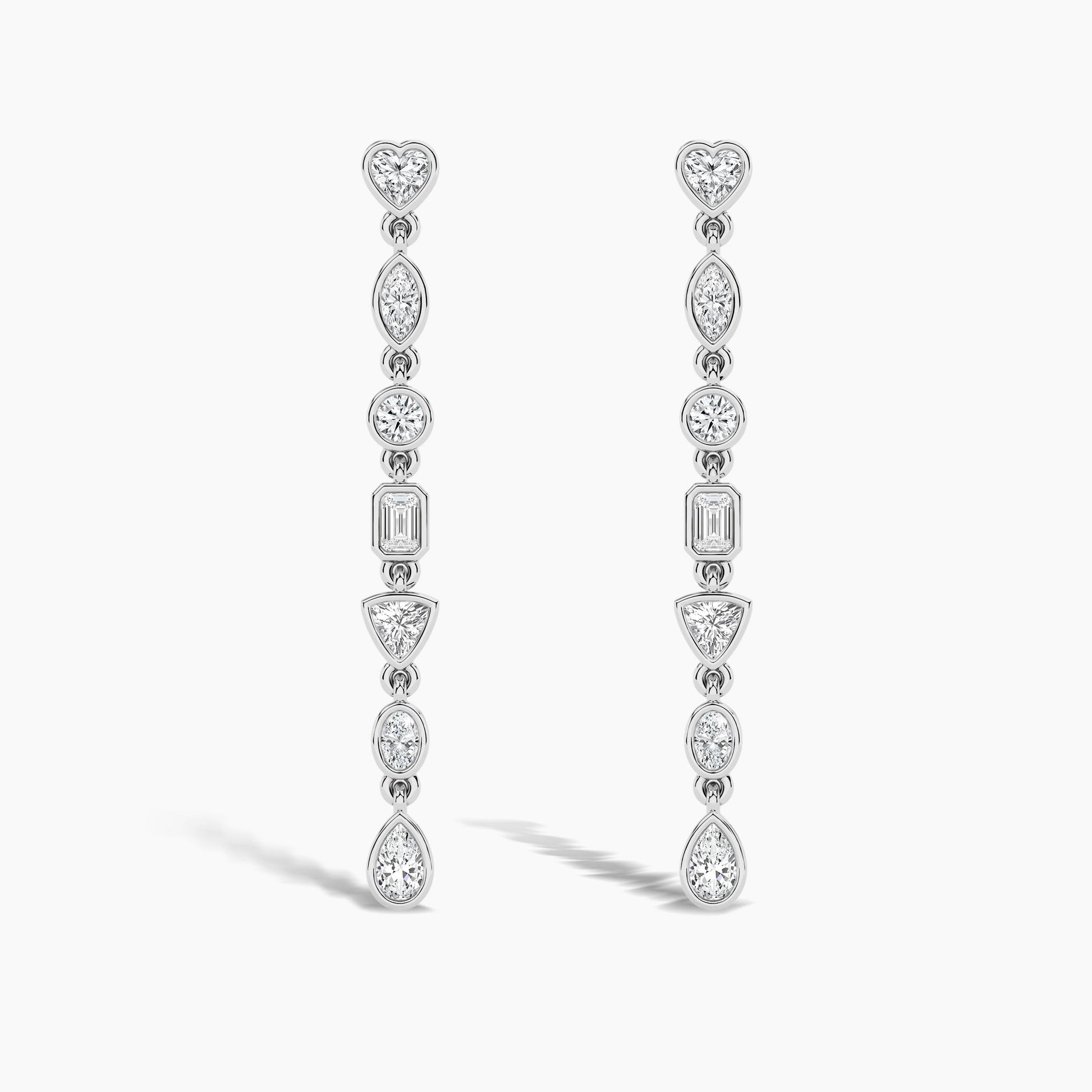 Pair of diamond earrings on a light gray background