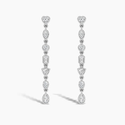 Pair of diamond earrings on a light gray background