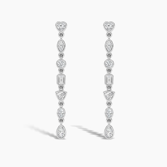 Pair of diamond earrings on a light gray background